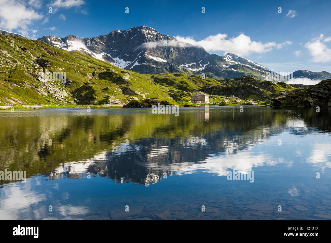 San Bernardino Pass, water reflection, Grison Alps, Graubünden Canton, Switzerland Stock Photo