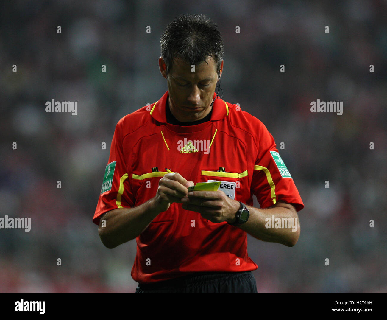 Referee Wolfgang Stark taking down names on Yellow Card, Franz ...