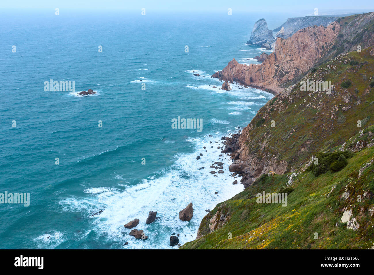 Atlantic ocean coast (granite boulders and sea cliffs) in cloudy ...