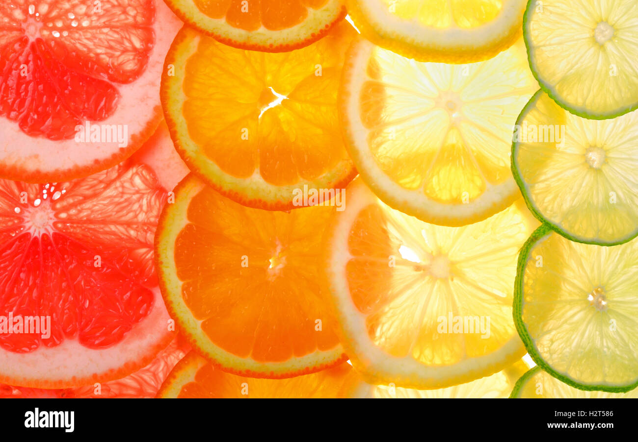 Sliced citrus fruits background Stock Photo Alamy