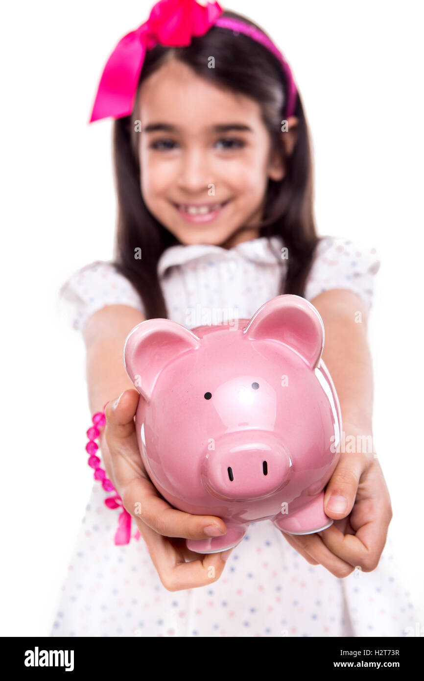 Girl holding a piggy bank Stock Photo - Alamy