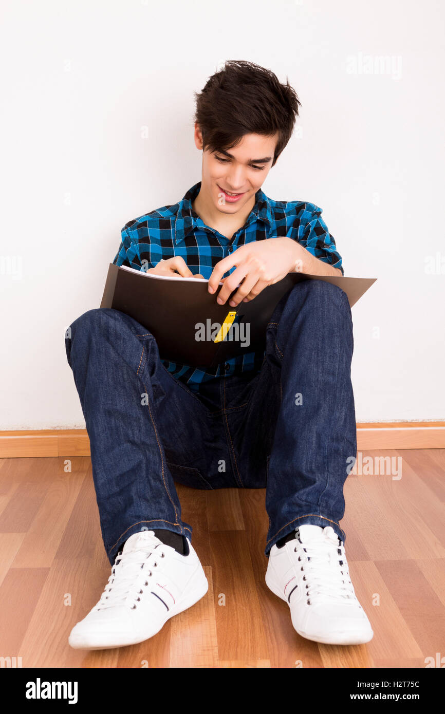 Young man studying at home Stock Photo - Alamy