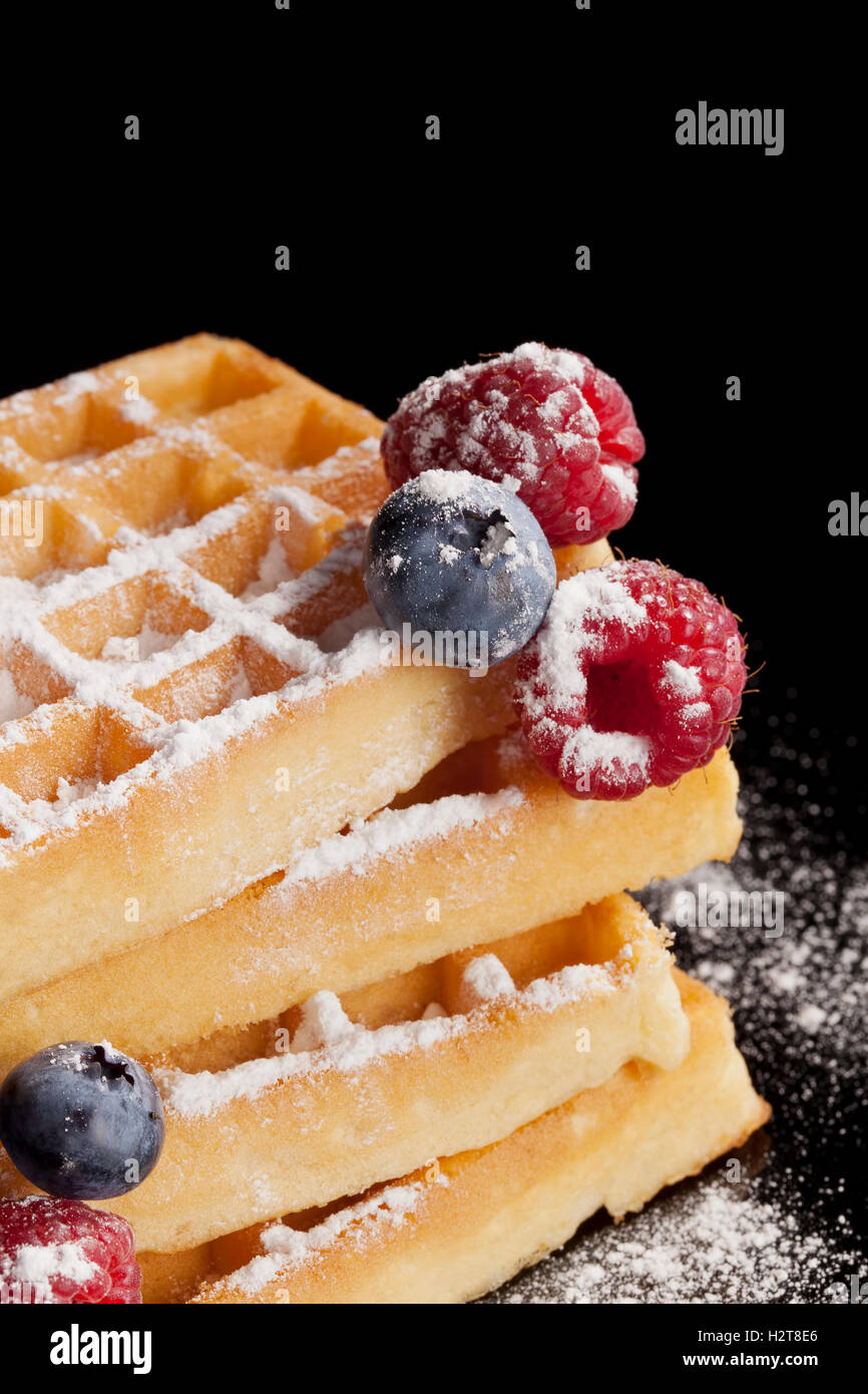 Sugared waffle with fresh berries Stock Photo - Alamy