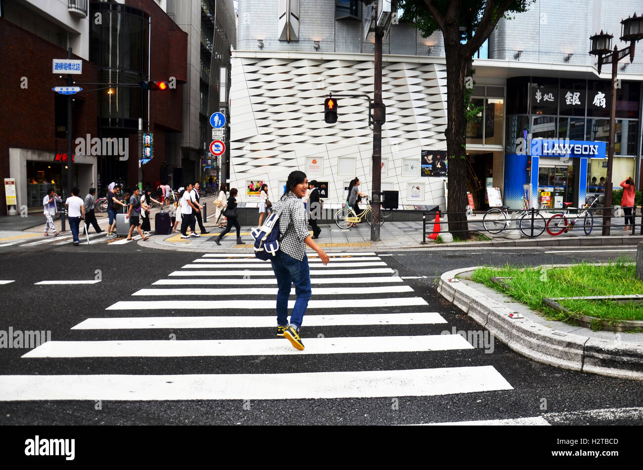 Japanese people and traveler foreigner walking cross over road at crosswalk go to Dotonbori on July 7, 2015 in Osaka, Japan Stock Photo