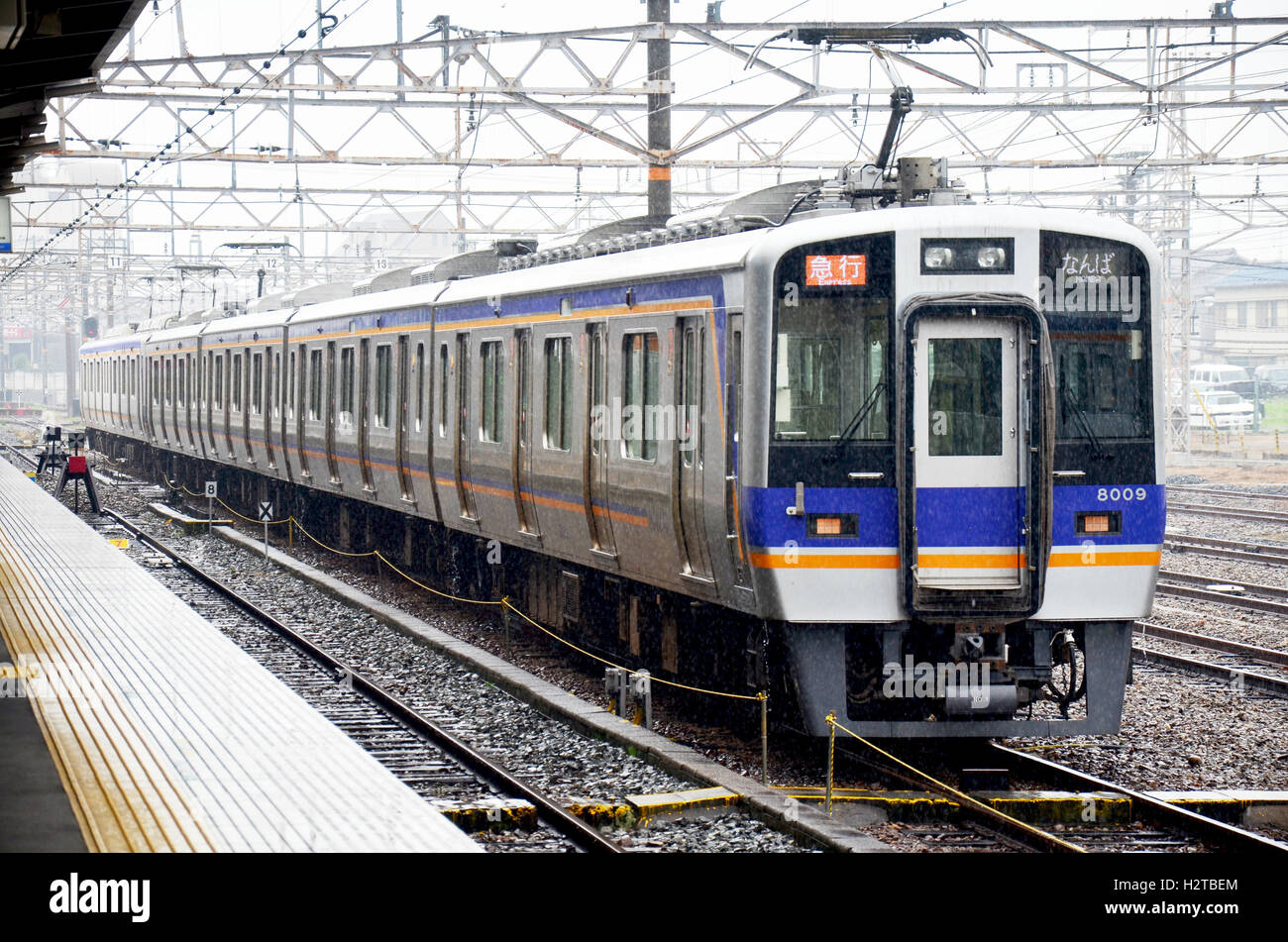 Trains stopping at Wakayama railway station while raining time on July 8, 2015 in Wakayama, Japan Stock Photo