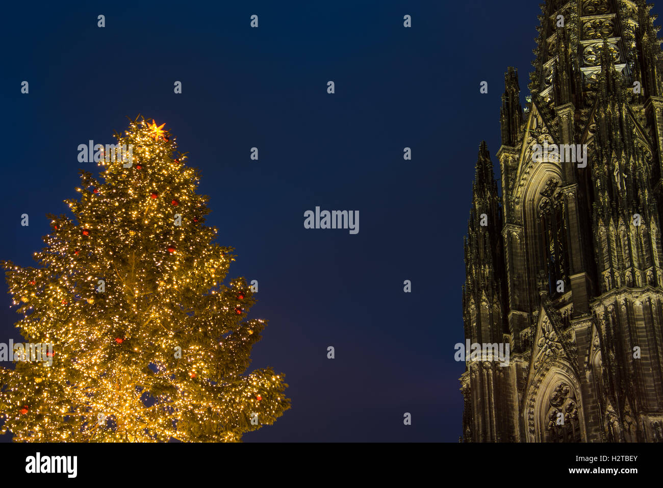 part of cologne cathedral and golden christmas tree with space Stock Photo