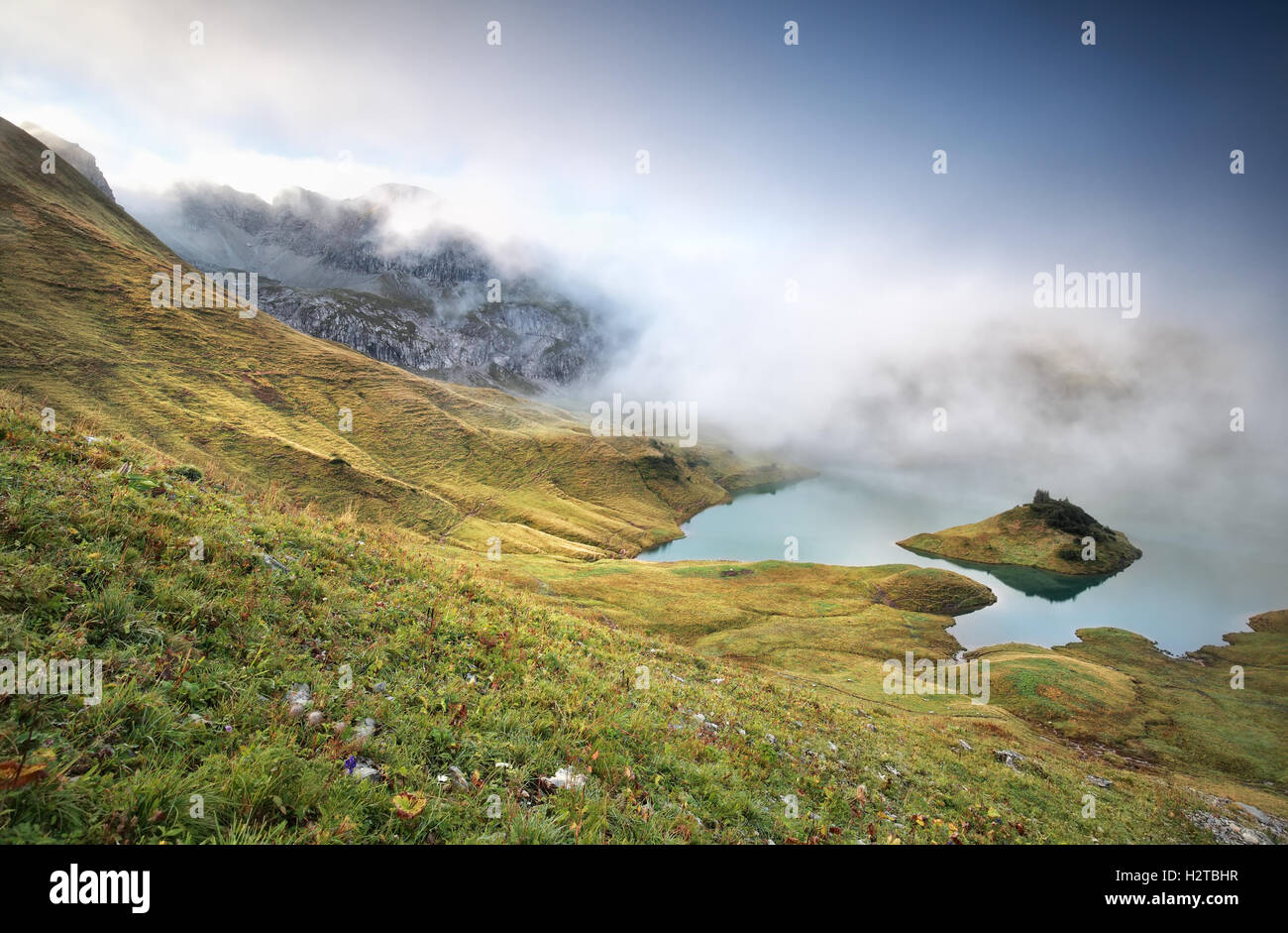 misty morning on alpine lake Schrecksee, Bavaria, Germany Stock Photo