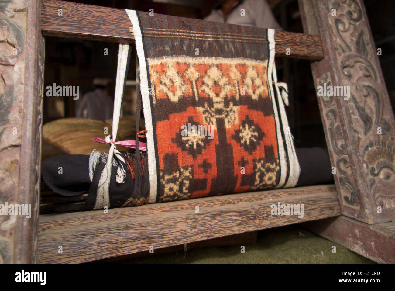 Indonesia, Bali, Tengannan, double ikat fabric being woven on backstrap loom Stock Photo