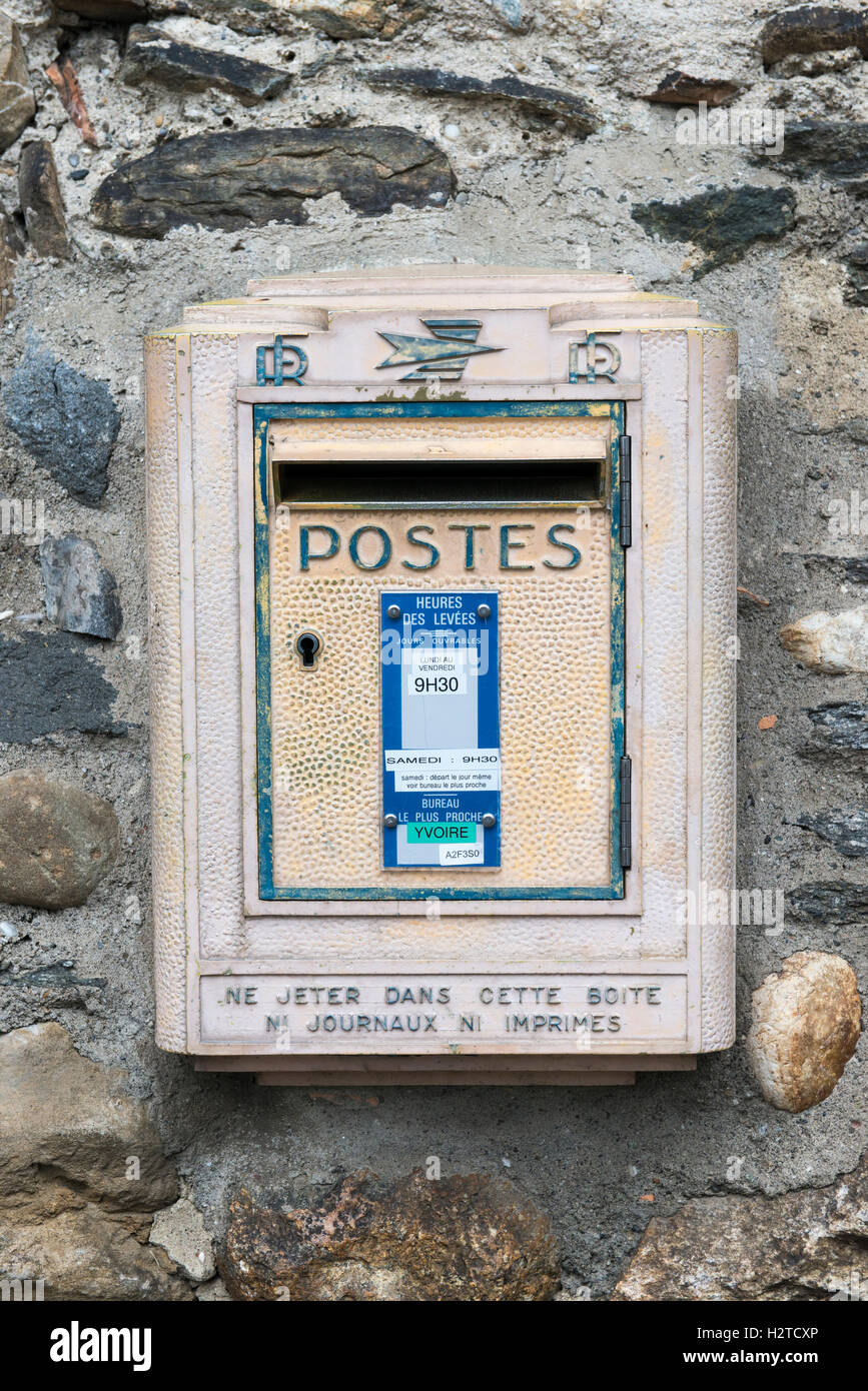 French letter box on a rock wall, medieval historic village of Yvoire, Haute-Savoie, France Stock Photo