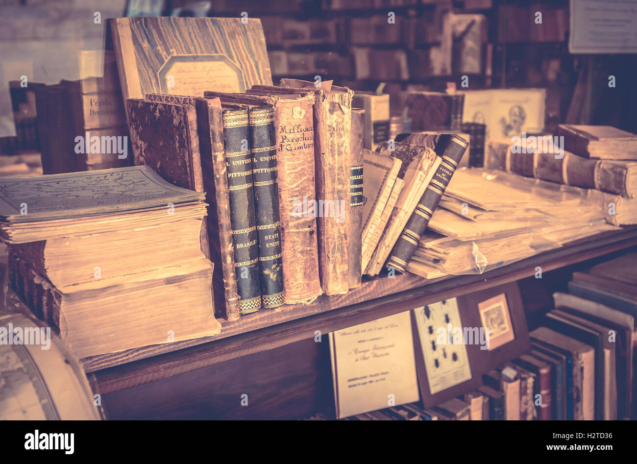 MONTEPULCIANO, ITALY - JUNE 23, 2015: collection of antique books and maps in tuscan antiquarian bookshop in Montepulciano town, Stock Photo