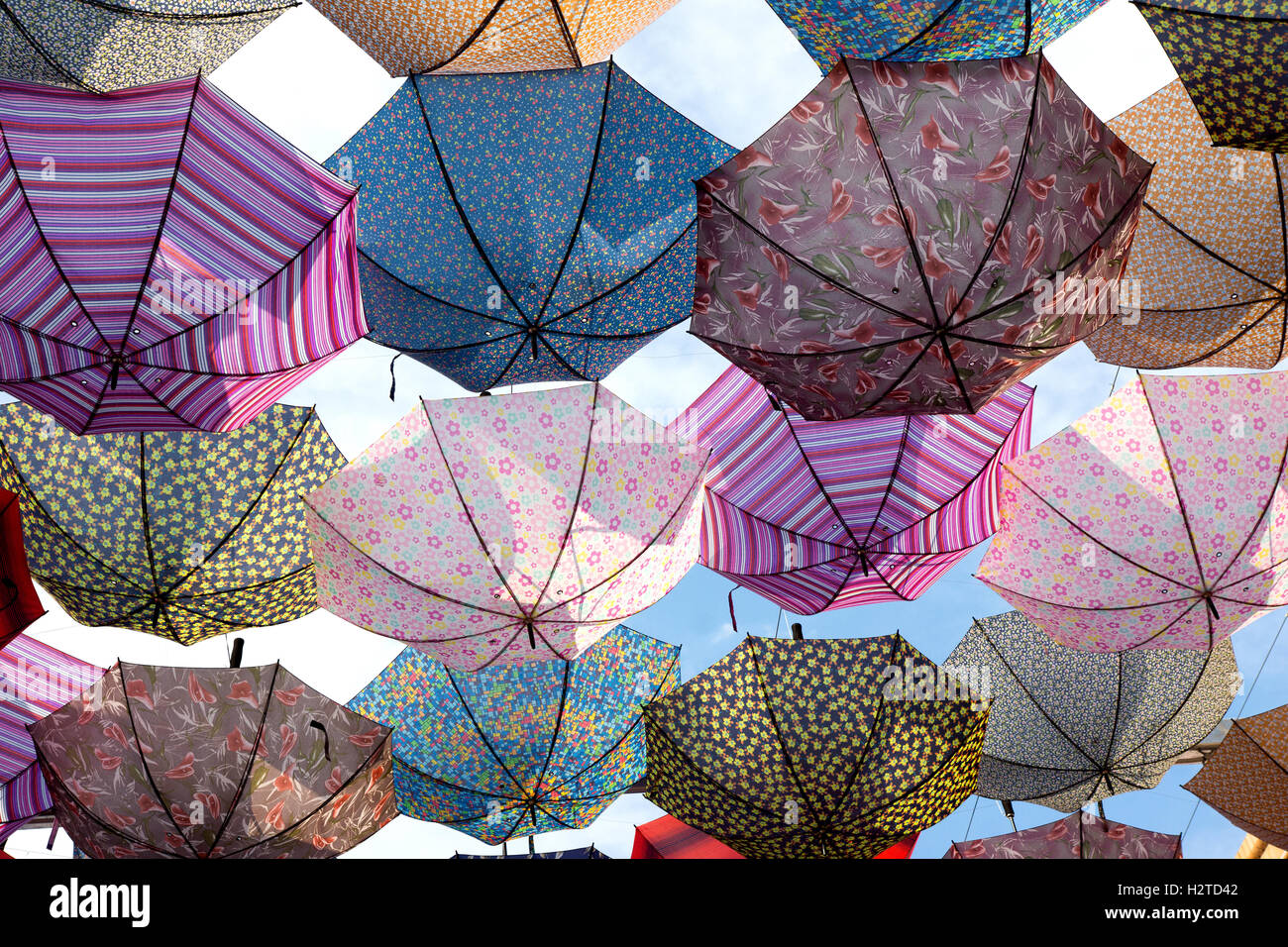 Colorful umbrellas flying in the sky Stock Photo - Alamy
