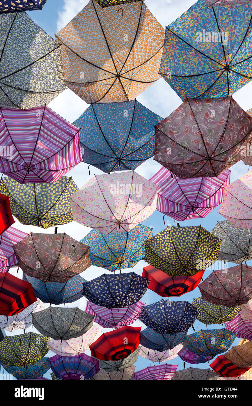 Colorful umbrellas flying in the sky Stock Photo - Alamy