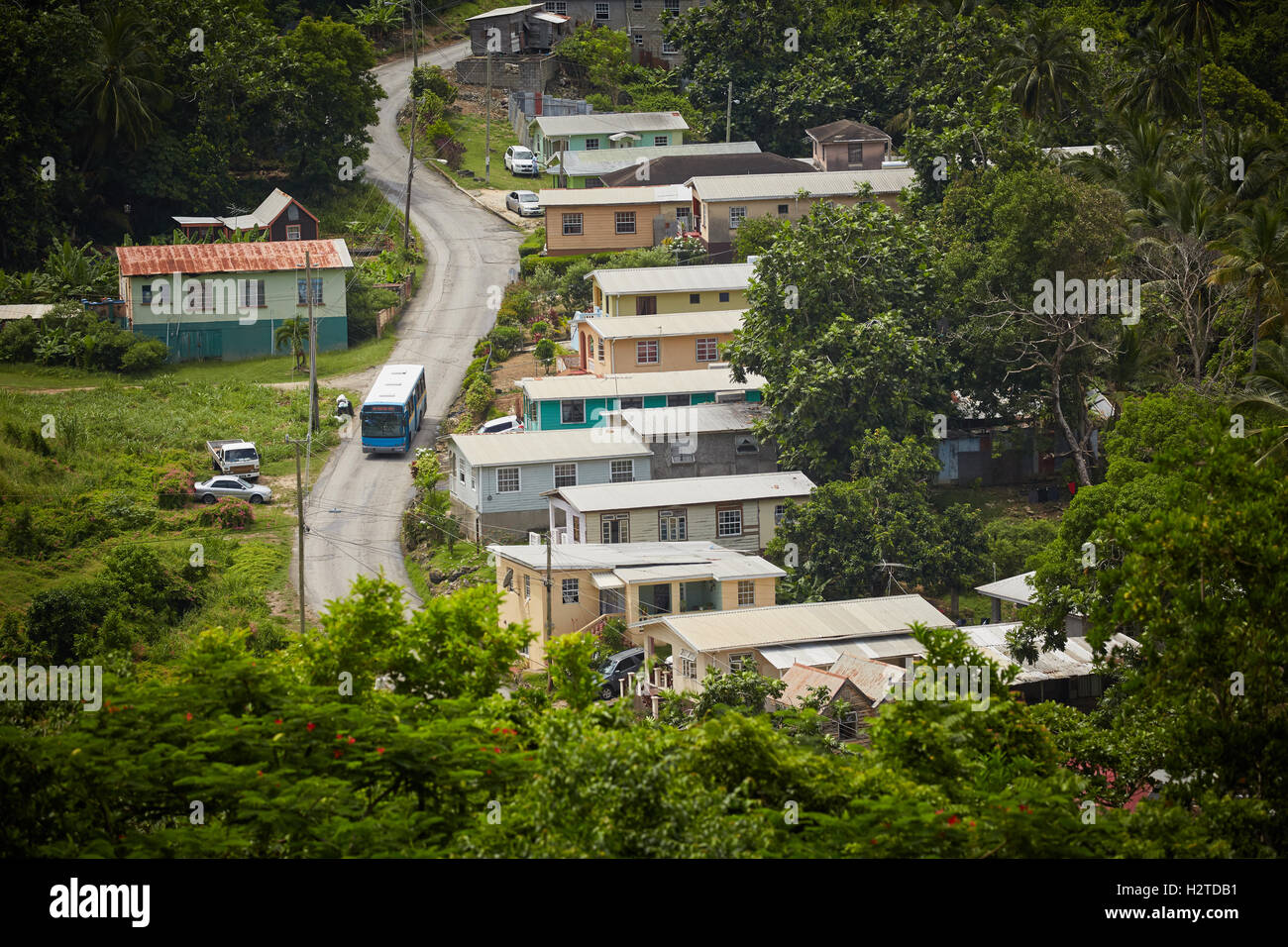 Barbados La Perruque shack houses   Village typical local houses Chattel Houses blue government state bus transport Transport tr Stock Photo