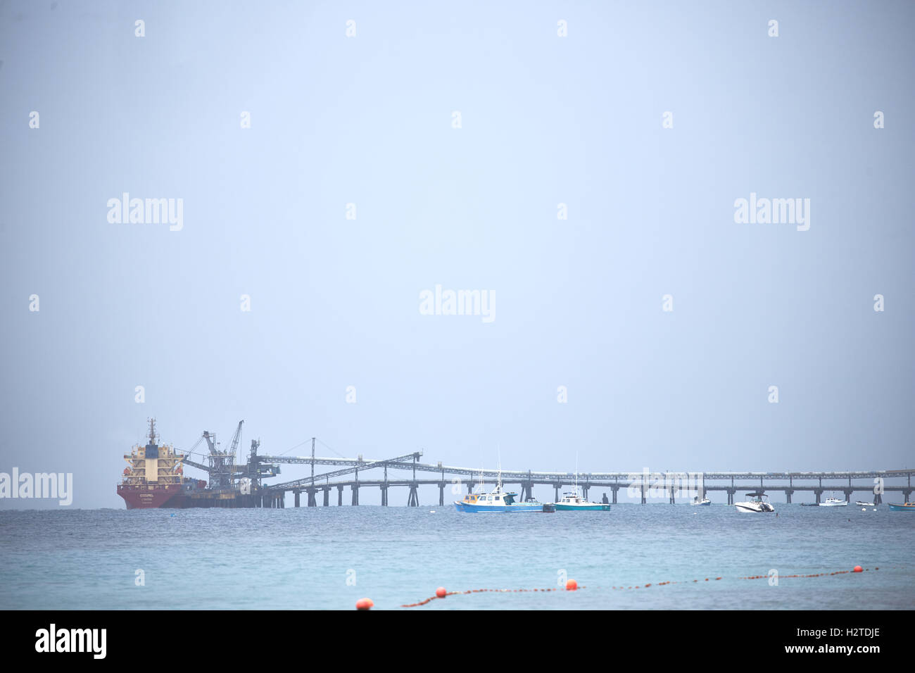 Barbados Arawak Cement Company  Pier out to sea large boat mored fryers well point from almond beach industrial industry Busines Stock Photo