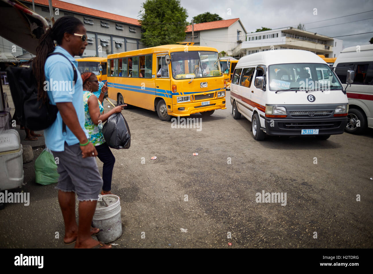 Barbados Oistins ZRs taxi bus yellow Bridgetown bus station Stock Photo ...