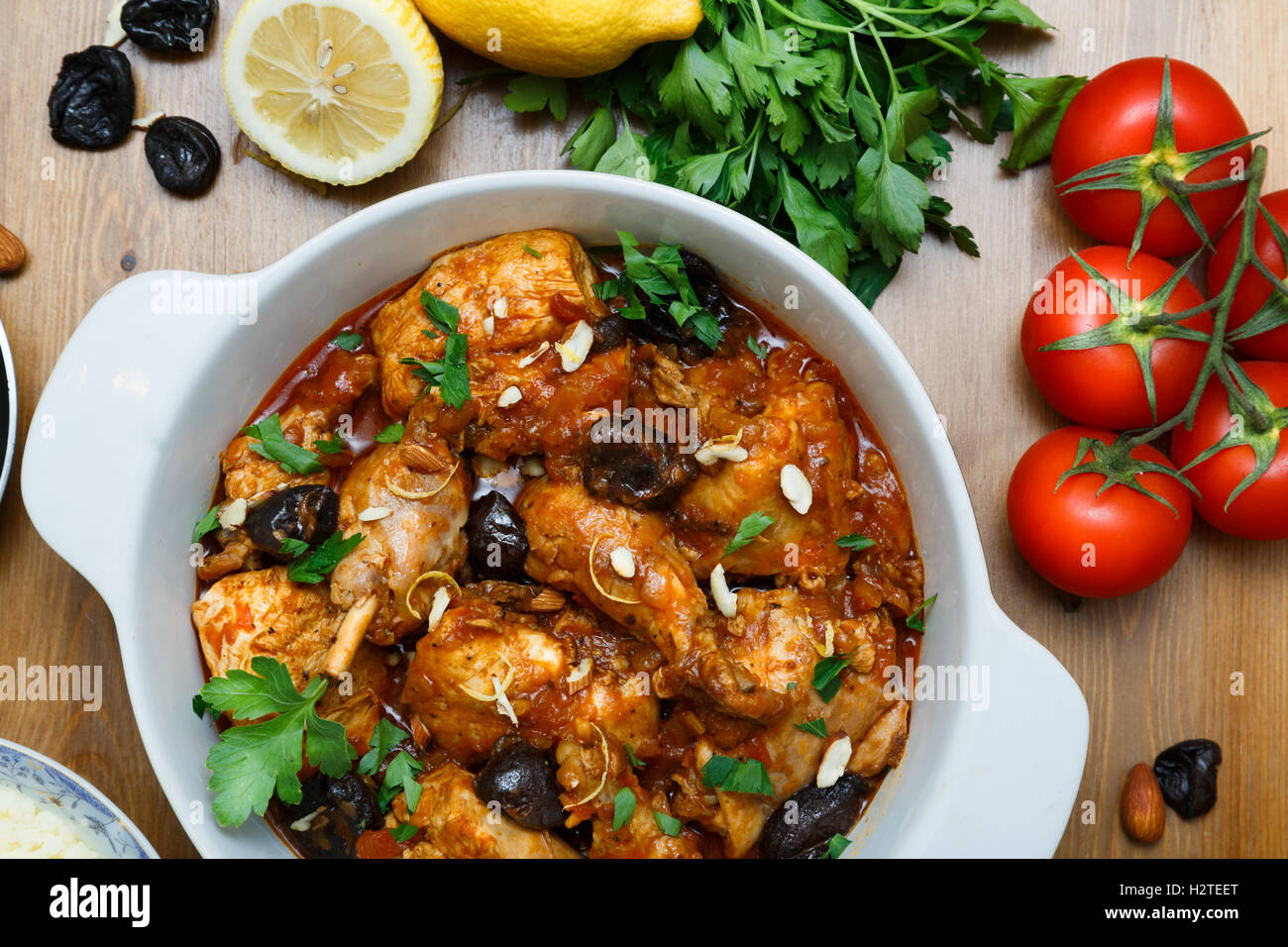 meal of chicken tagine stew in a spicy, nutty tomato sauce and prunes Stock Photo