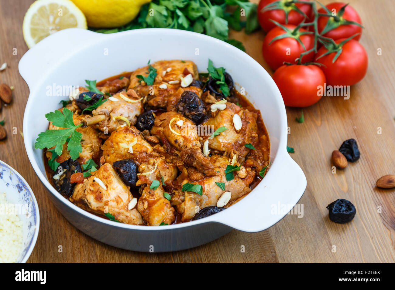 meal of chicken tagine stew in a spicy, nutty tomato sauce and prunes Stock Photo