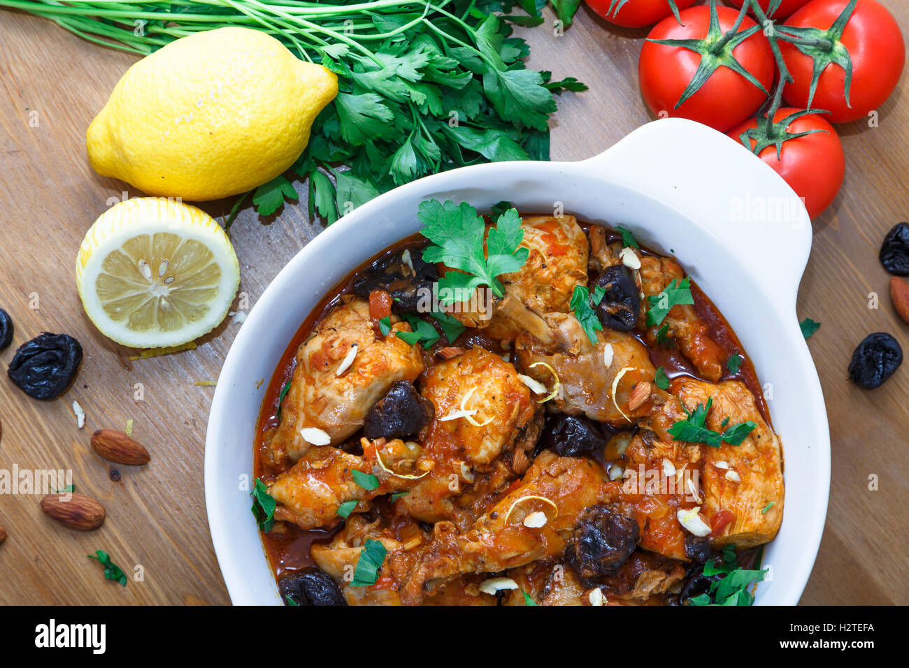 meal of chicken tagine stew in a spicy, nutty tomato sauce and prunes Stock Photo
