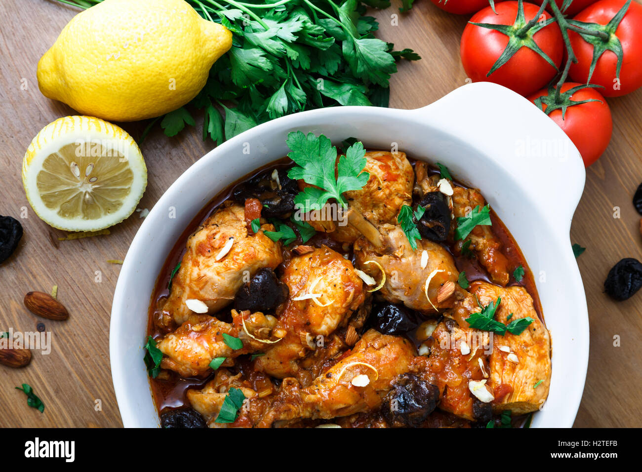 meal of chicken tagine stew in a spicy, nutty tomato sauce and prunes Stock Photo