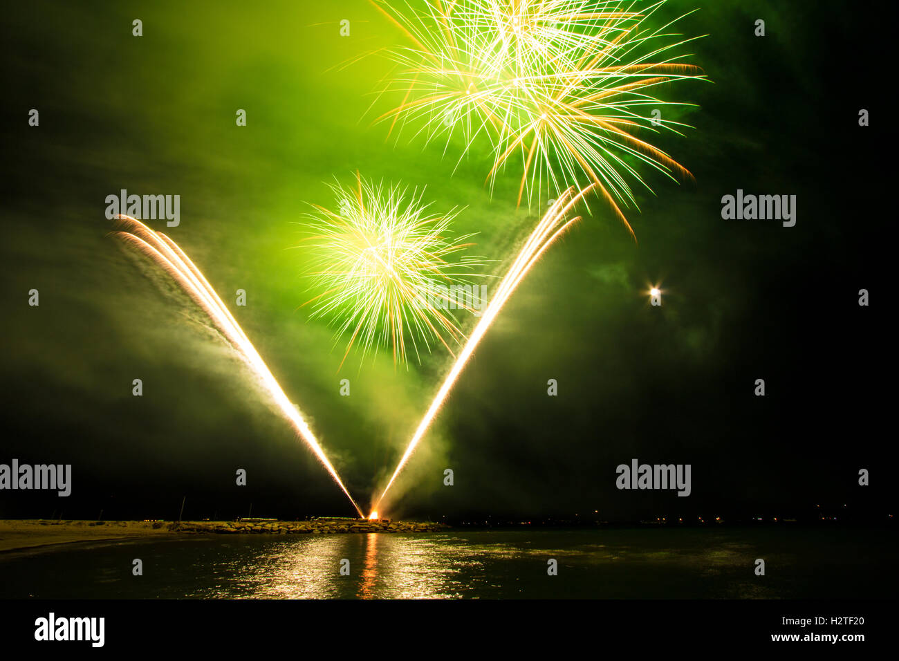 Fireworks in water on sea near Follonica, Italy Stock Photo