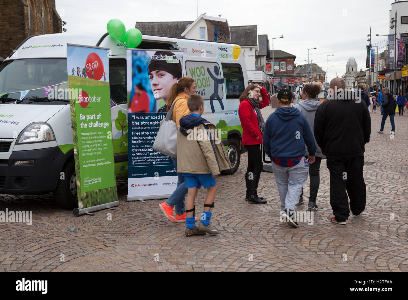 Stop Smoking campaign. A private company, Solutions4Health, contracted by Blackpool Council to try and reduce the number of smokers in the resort which is about 30% much higher than the Uk national average. Stoptober, a campaign challenge vehicle in St John's Square, Blackpool, UK Stock Photo