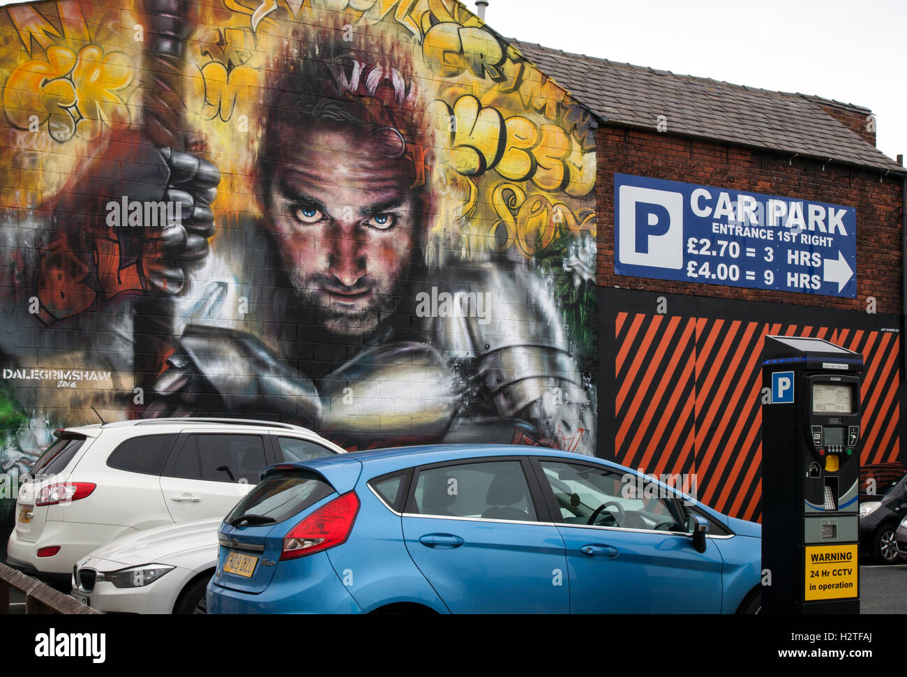 Glaring eyes watching over Car park; Parking Eye Fines & Regulations and Art Graffiti on Cookson Street Car park walls part of the Re-style Blackpool Project,  Lancashire, UK, 2016 Stock Photo