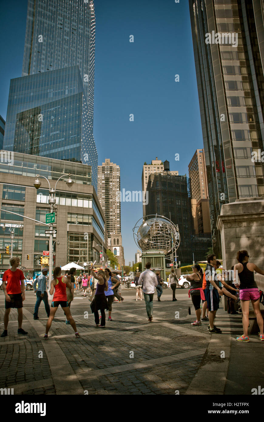 People doing fitness routine at Columbus Circle, New York Stock Photo