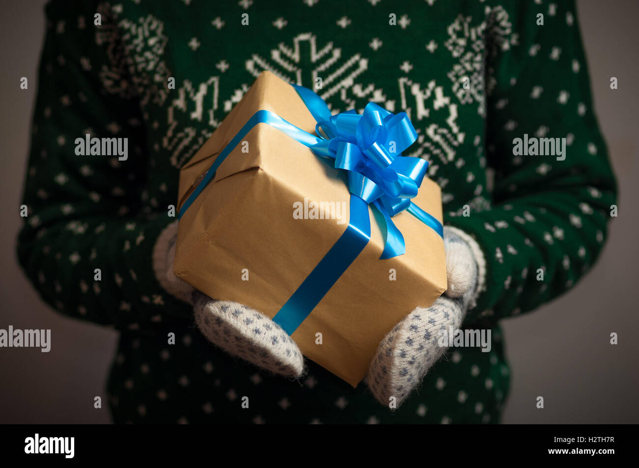 Girl holding a Christmas gift Stock Photo