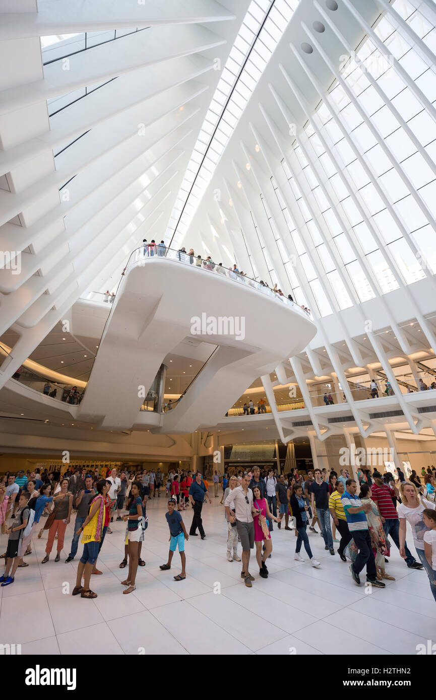NEW YORK CITY - SEPTEMBER 4, 2016: Crowds of passengers pass under the distinctive architectural form of the Oculus. Stock Photo