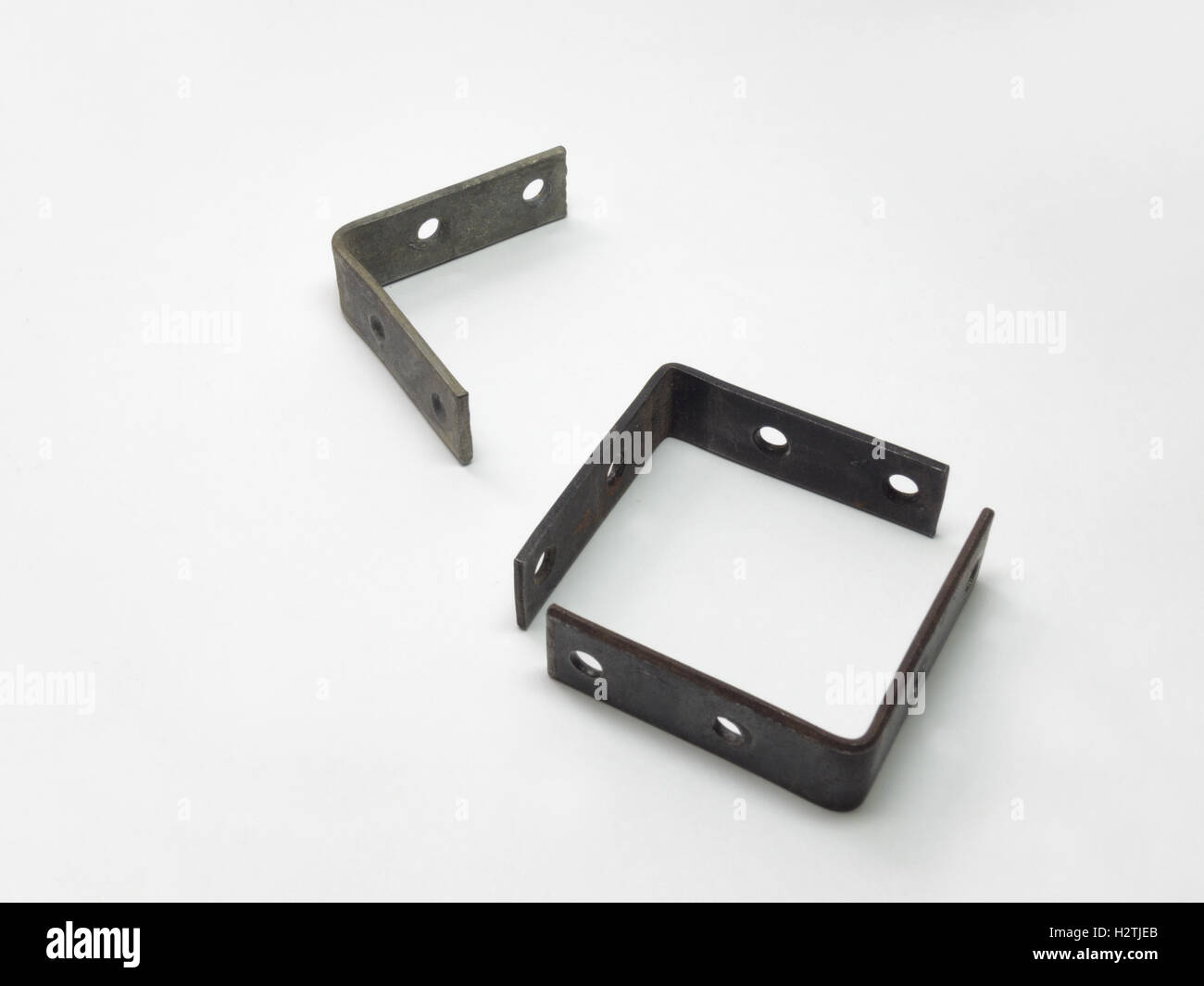The metal mounting brackets with holes for screws Stock Photo Alamy