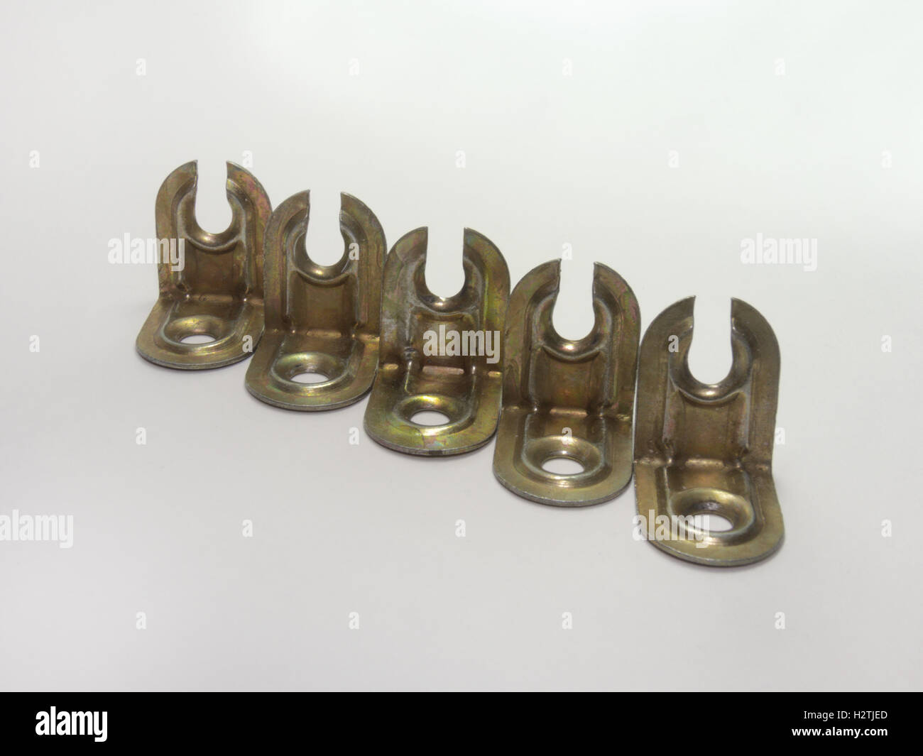 Corners for furniture assembly. A metallic type of fastener. Laid out