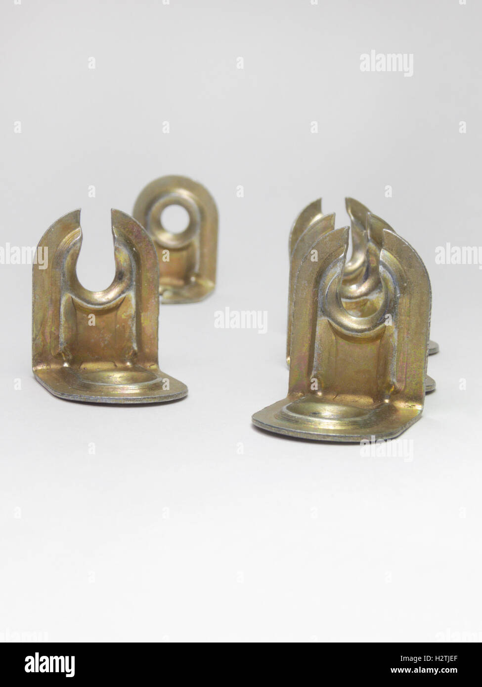 Gilded corners for furniture assembly. A metallic type of fastener