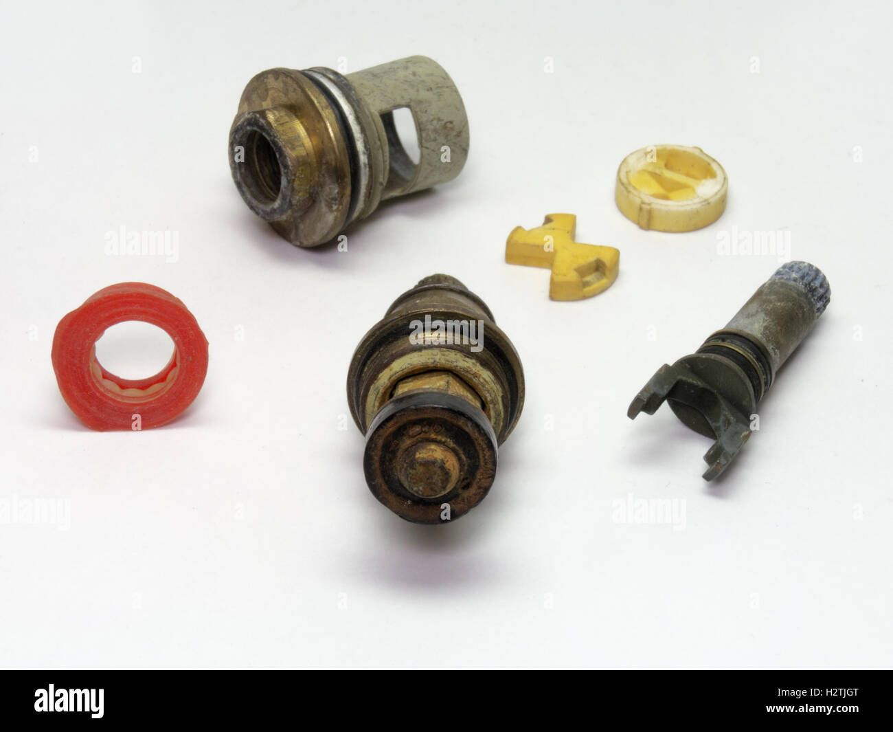 Parts of disassembled ceramic and rubber shut-off valves for the plumbing. A very detailed view Stock Photo