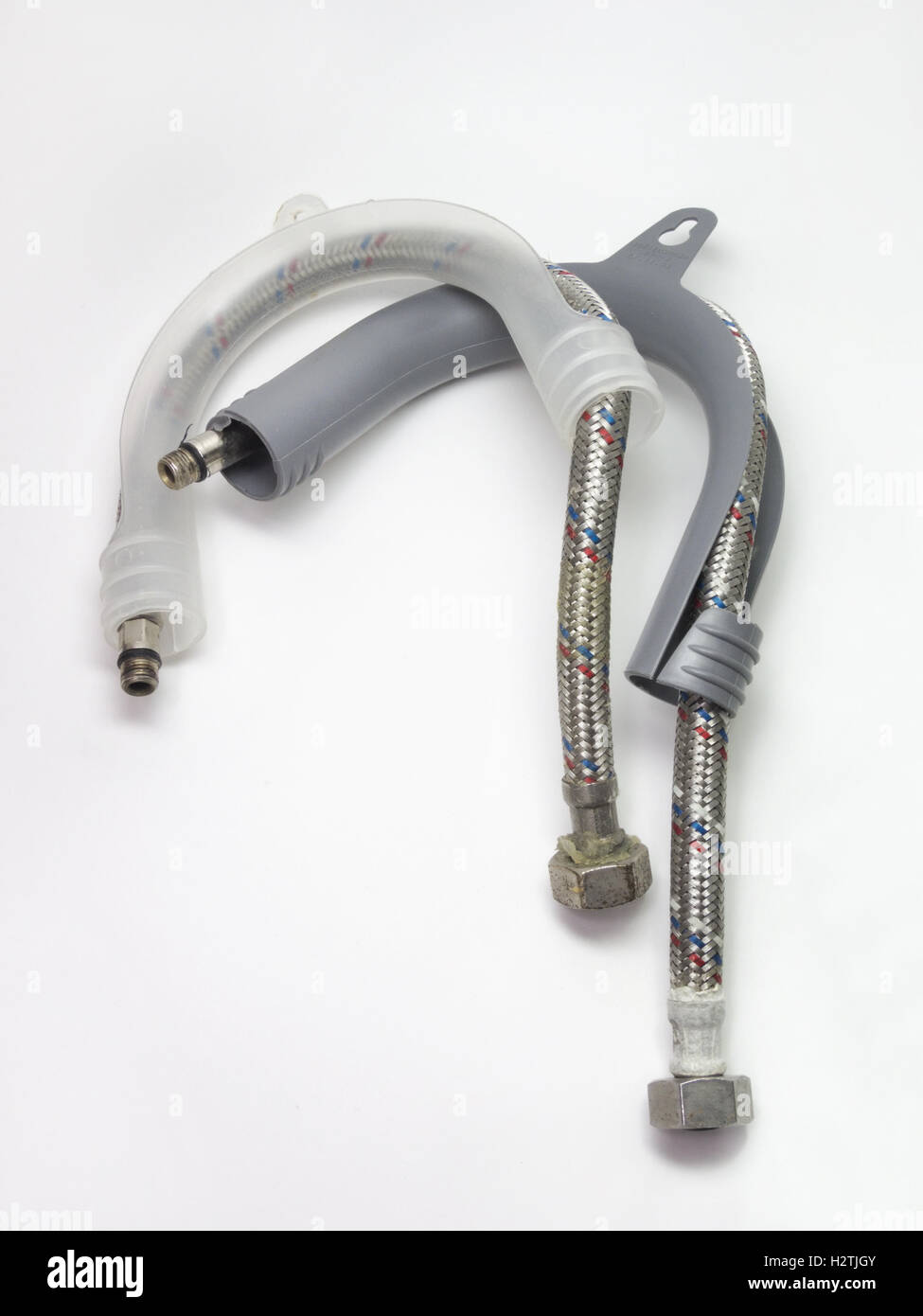 Flexible plumbing hoses, already in mounts Stock Photo Alamy