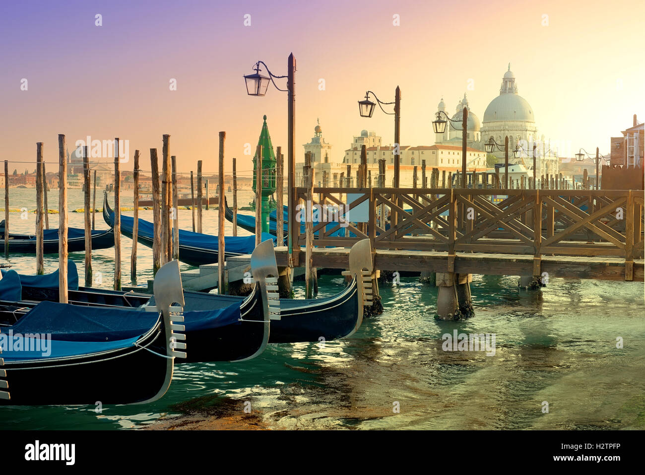 Gondolas and basilica Santa Maria della Salute in Venice, Italy Stock Photo