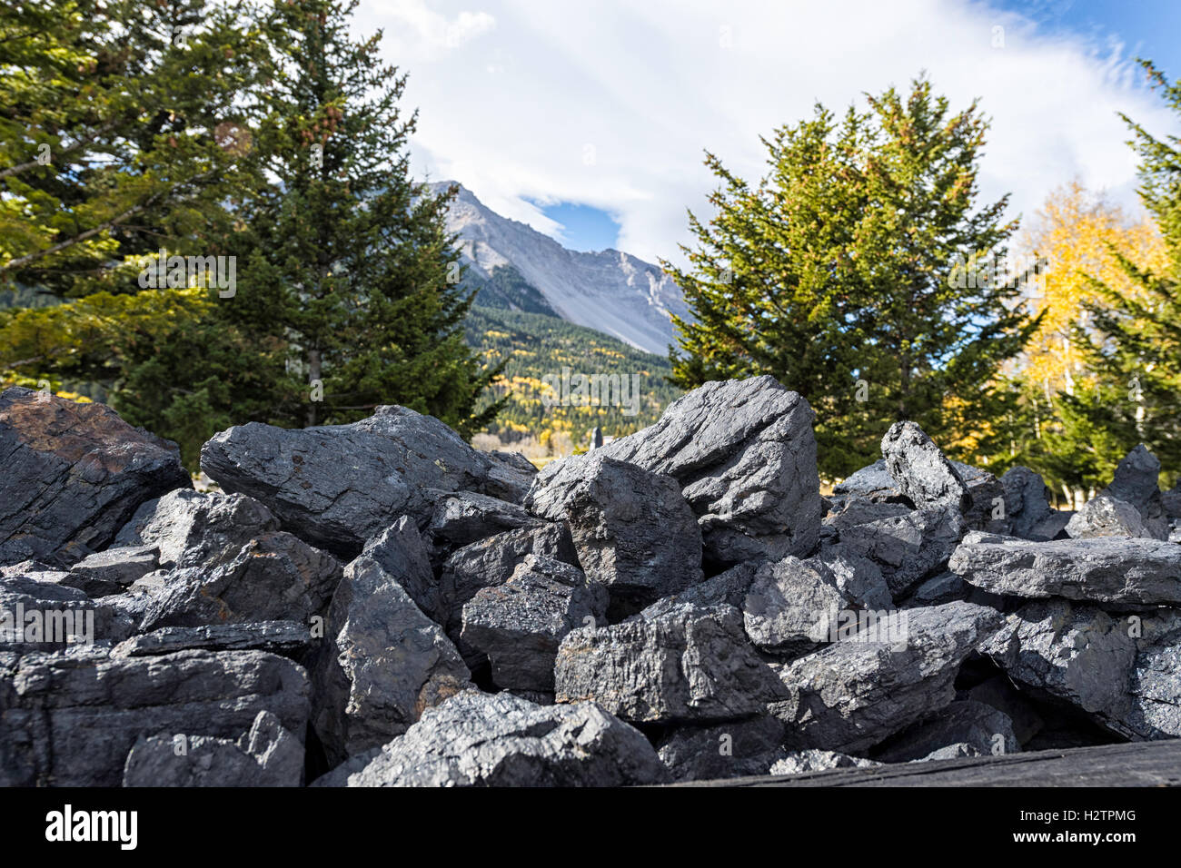 Coal cart monument at the Hillcrest Cemetery in Alberta Canada. Turtle mountain in the background Stock Photo