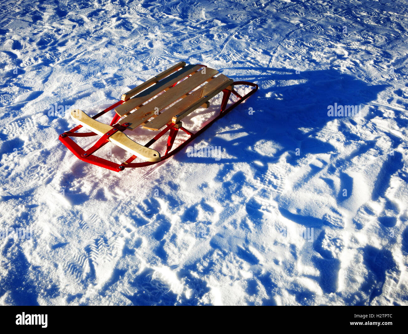Sledding in snow fresh powder tracks Stock Photo