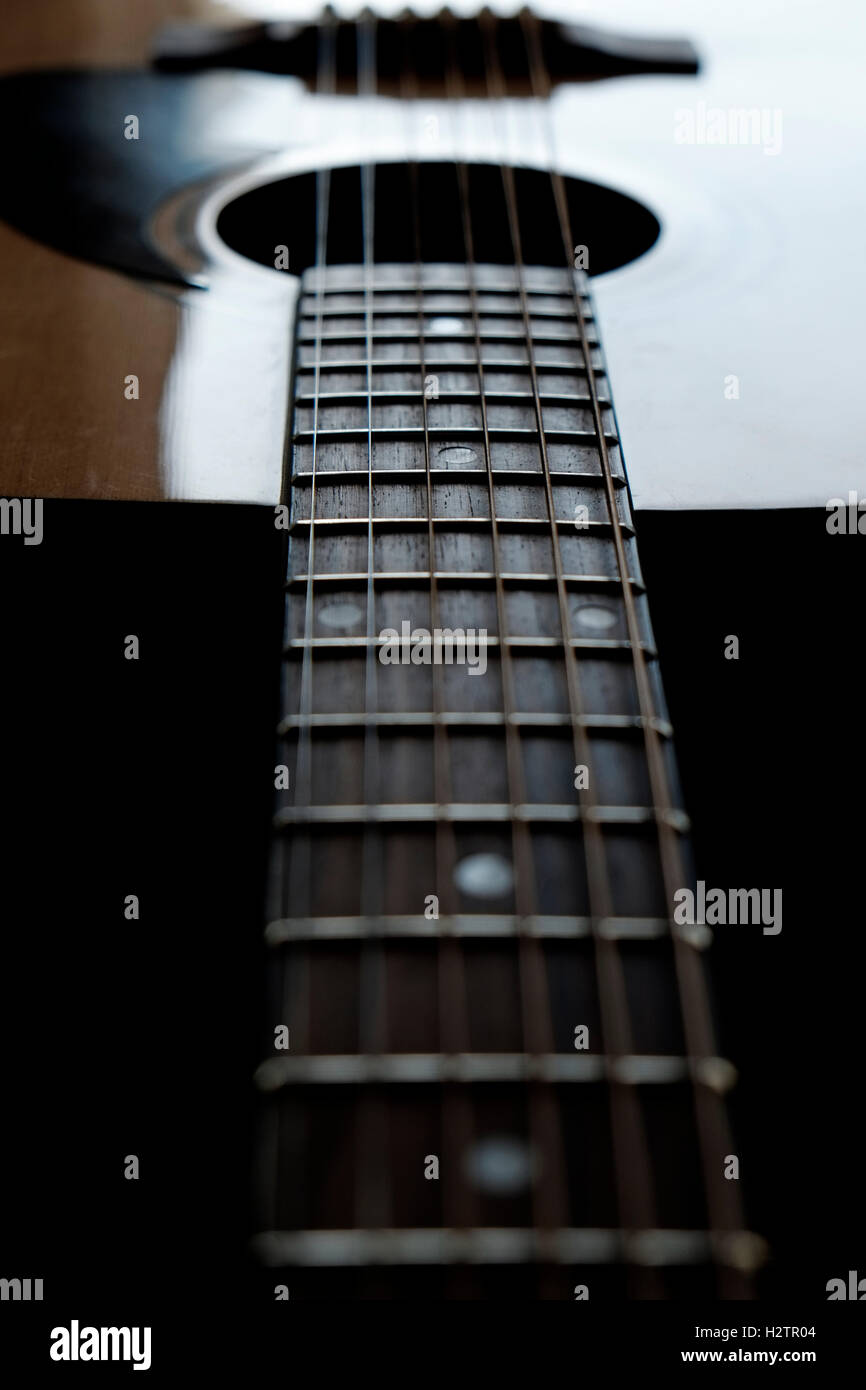 Closeup detail of guitar strings for playing music instrument talent strum strumming Stock Photo