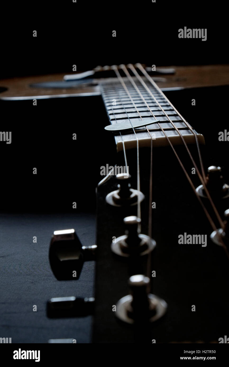 Closeup detail of guitar strings for playing music instrument talent strum strumming Stock Photo