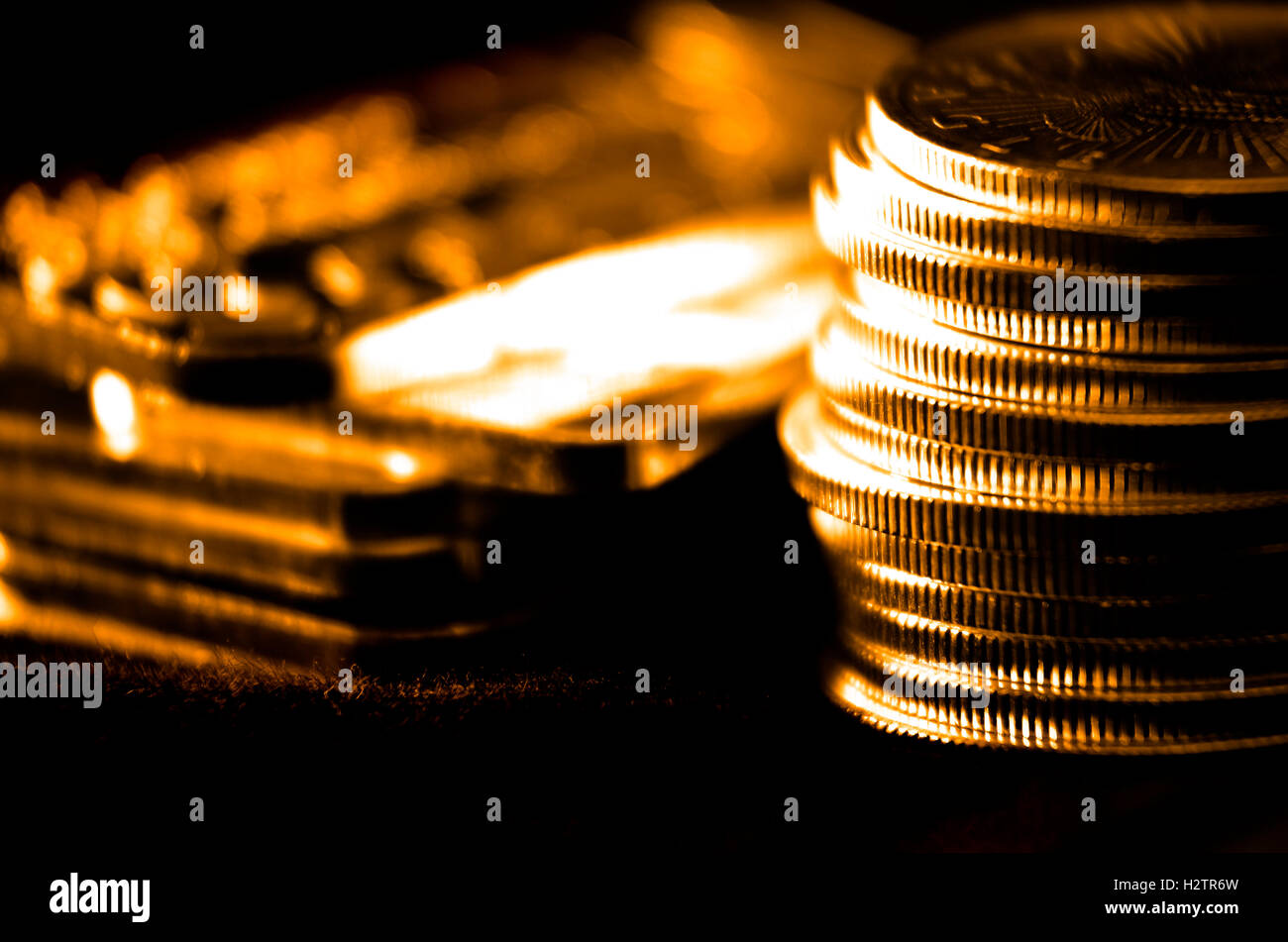 Pile of old coins and bullion with dark background Stock Photo