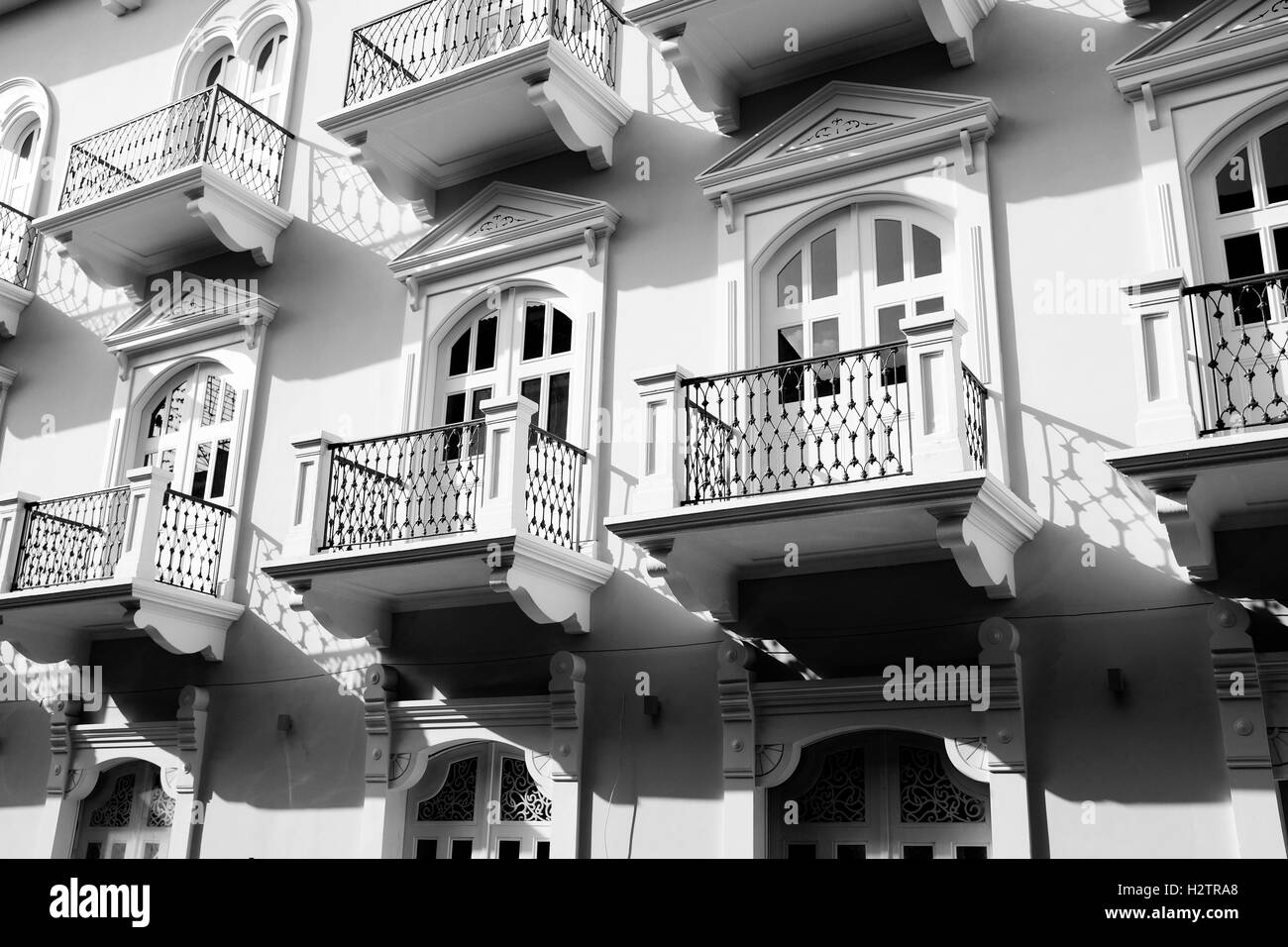 Detail of old balconies balcony on building with decorative windows and doors Stock Photo