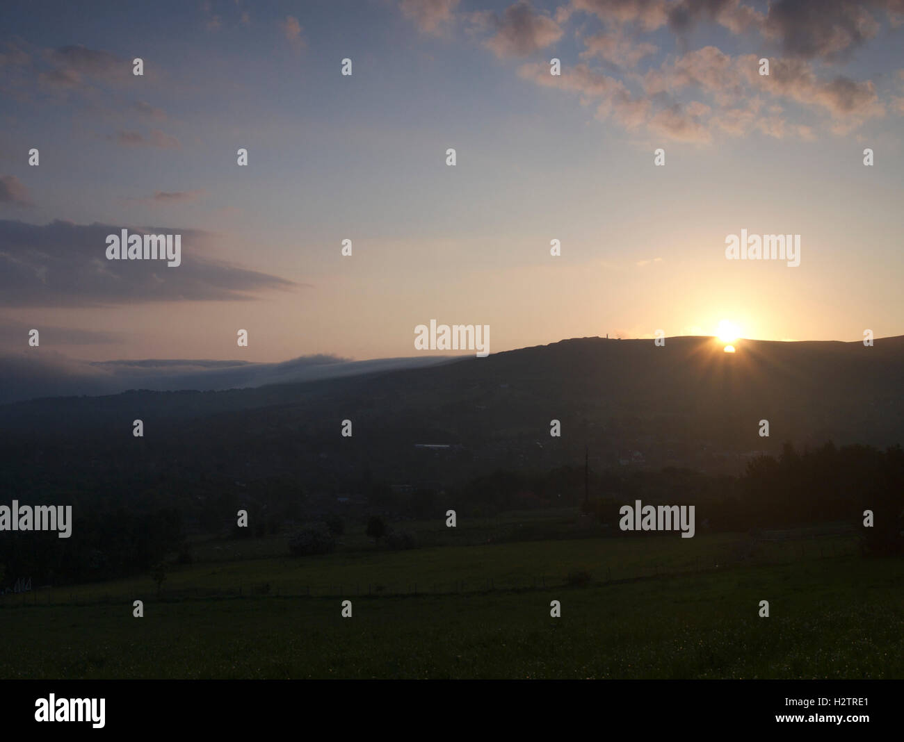 Sunrise over Pots and Pans from fields below Lane End Farm on Noon Sun Hill, Greenfield in Saddleworth. Stock Photo