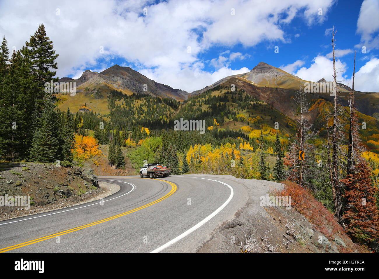 flat bed truck on mountain road in fall season Colorado Rocky Mountain ...