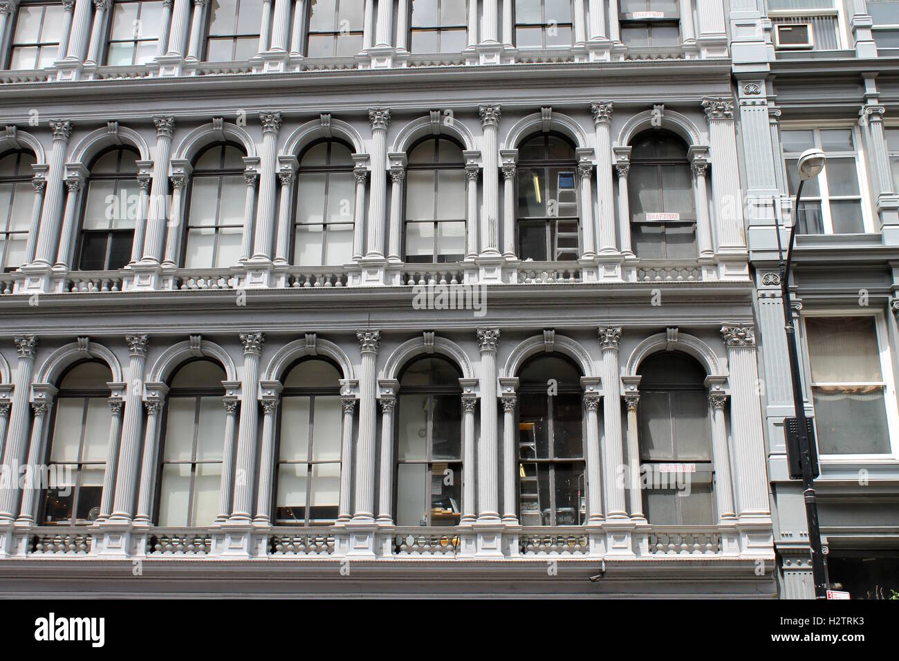 Vintage apartment building in New York City with arched windows Stock