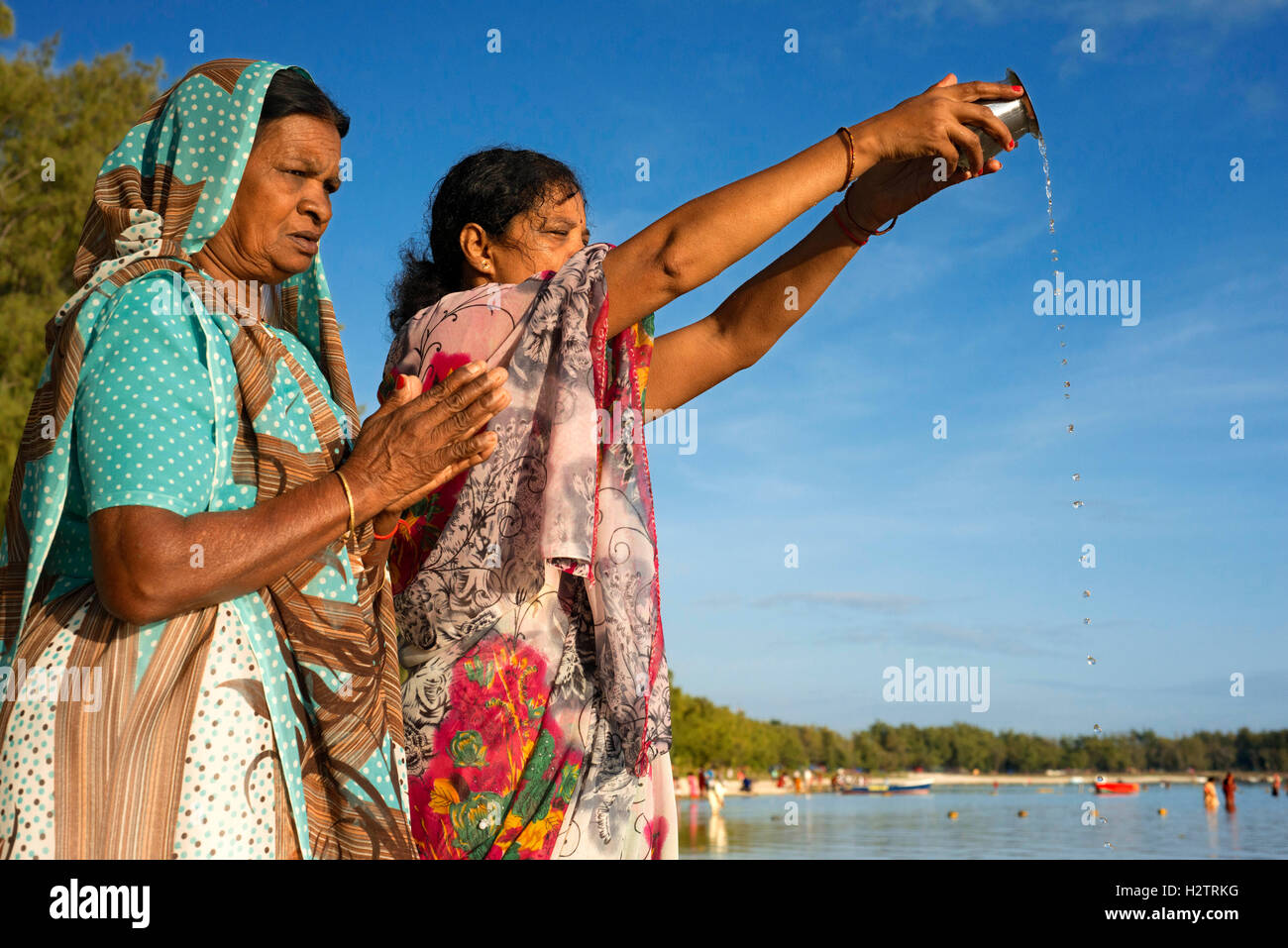 Ganga Snan (Asnan) Hindu, festival, Hindu families making puja on Belle Mare beach, Mauritius Island. Stock Photo