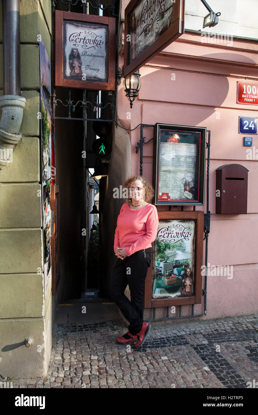 Prague's narrowest street Vinarna Certovka is so tiny that traffic lights have been installed. Stock Photo