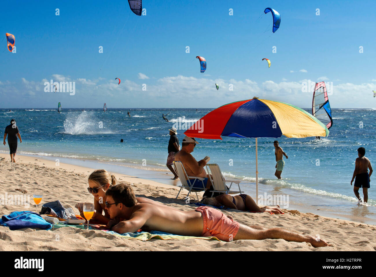 Sunbath and Water sports in Le Morne public beach, Mauritius. Stock Photo