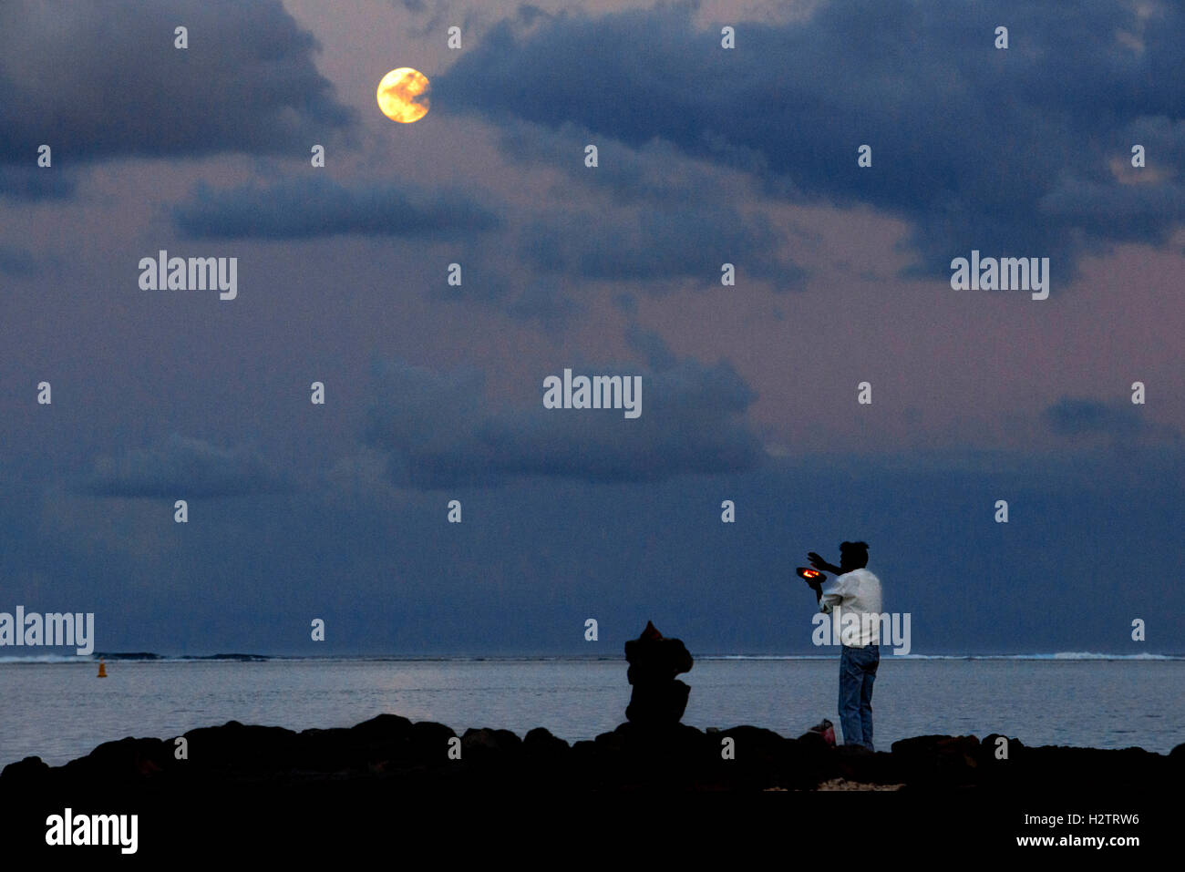 Ganga Snan (Asnan) Hindu, festival, Hindu families making puja in full moon on Belle Mare beach, Mauritius Island. Stock Photo