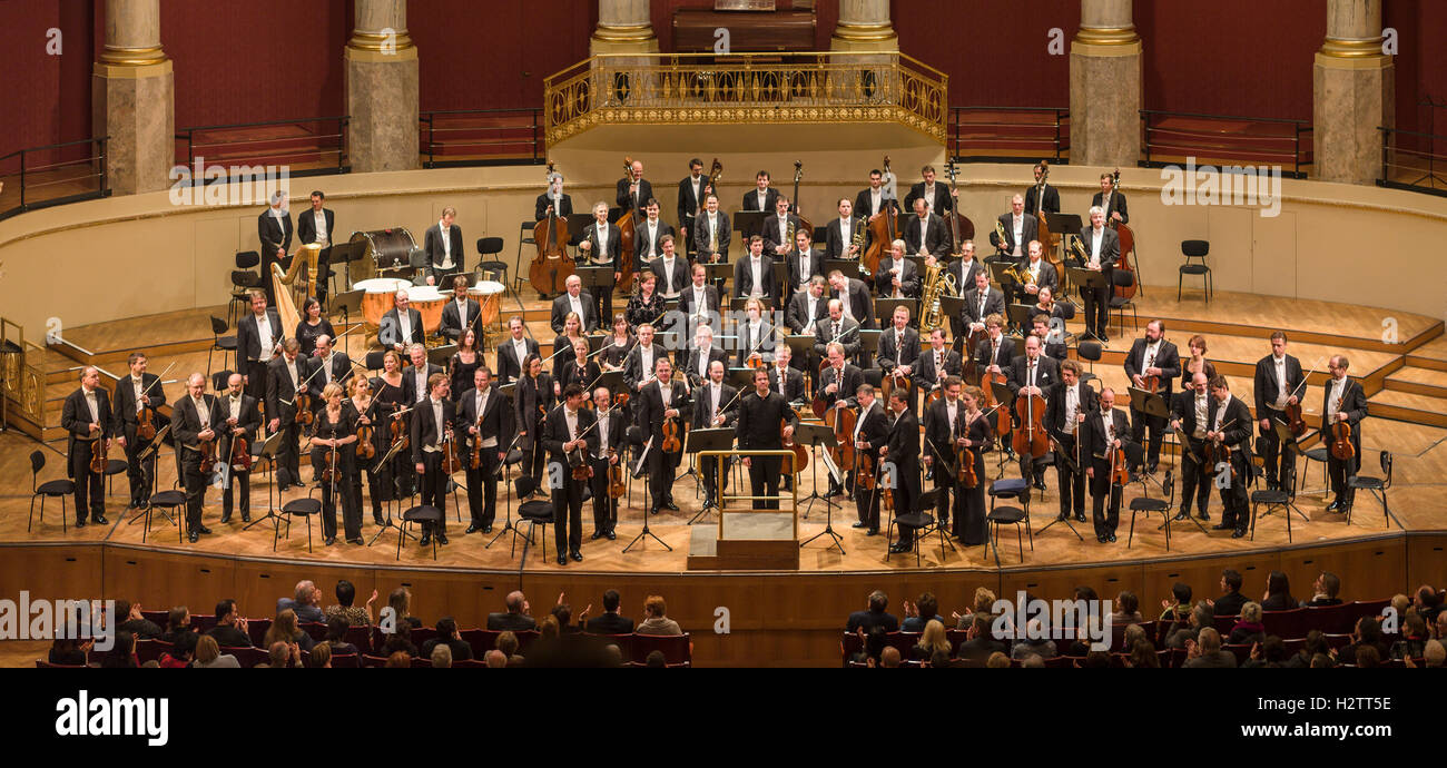 Conductor and Orchestra Applauded.The audience applauds while the players stand and accept the appreciation. Weiner Symphoniker/Elvind Gullberg Jensen Stock Photo