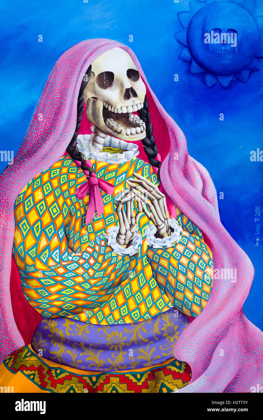 Detail of Jorge Luna painting of  a dressed skeleton. A colorful image of a female, shawl draped, skeleton clapping its hands by Stock Photo